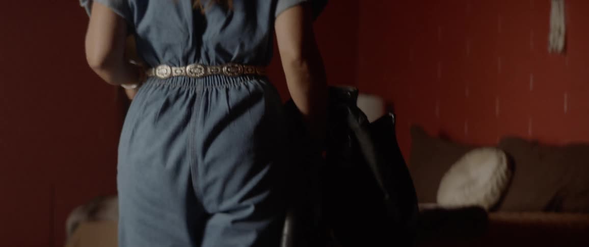 A woman put something on the bed