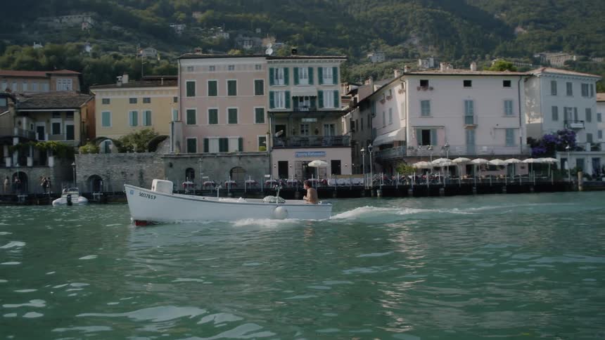 A person boats along a shoreline