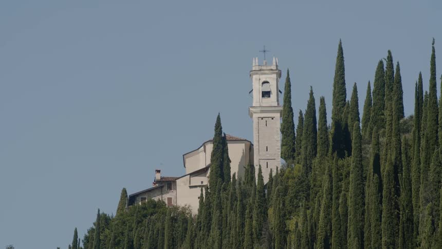 A church is in the distance with trees around it