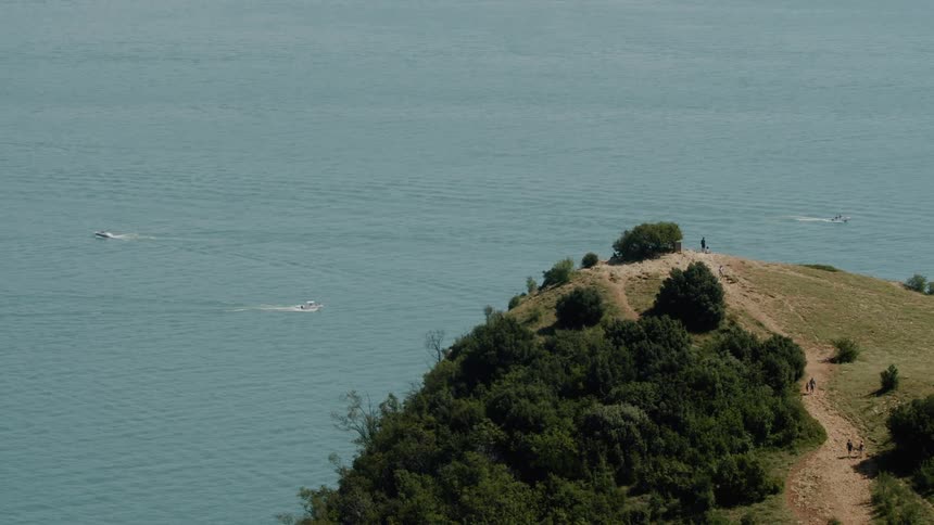 An aerial view of a hill near ocean