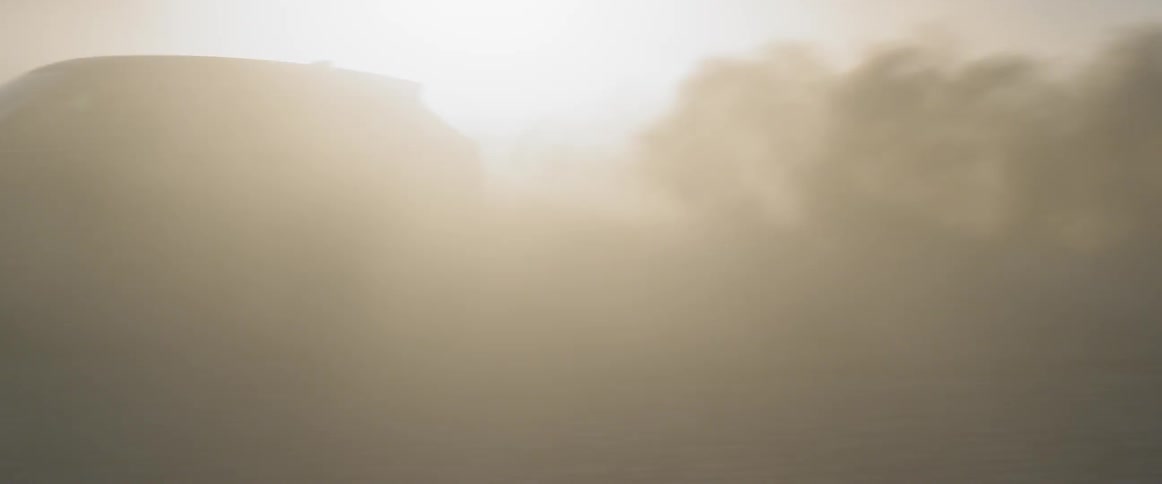 Range rover sports creating dust clouds at sunset on the salt flats