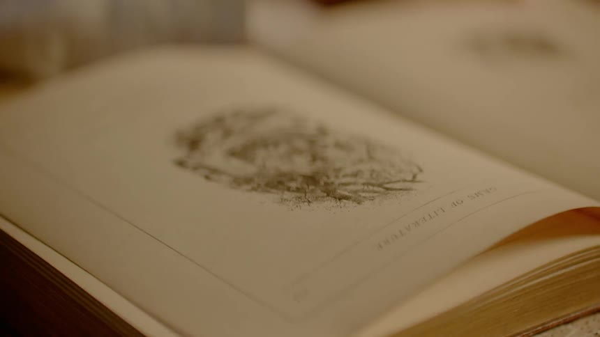 A person is reading a book indoors
