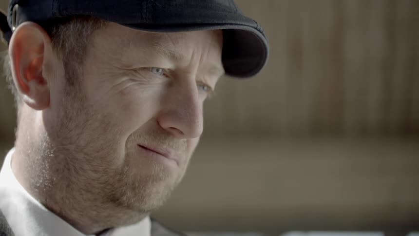 A sad smile from a man with hat