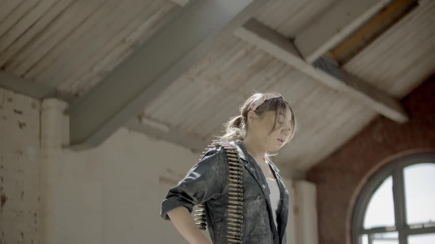 A woman with bullet on his shoulder