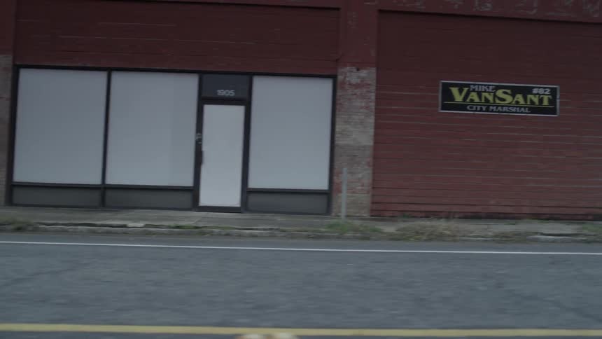 Passing view of closed-up shops