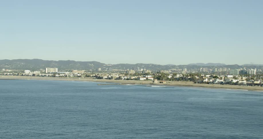 Aerial approach of Marina Del Rey over the Pacific ocean