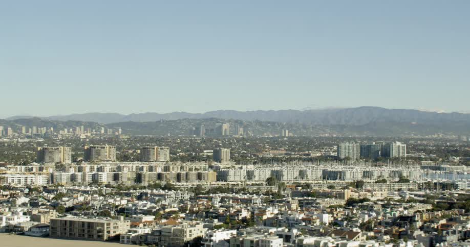 Aerial tracking shot of Venice Beach and Marina Del Rey