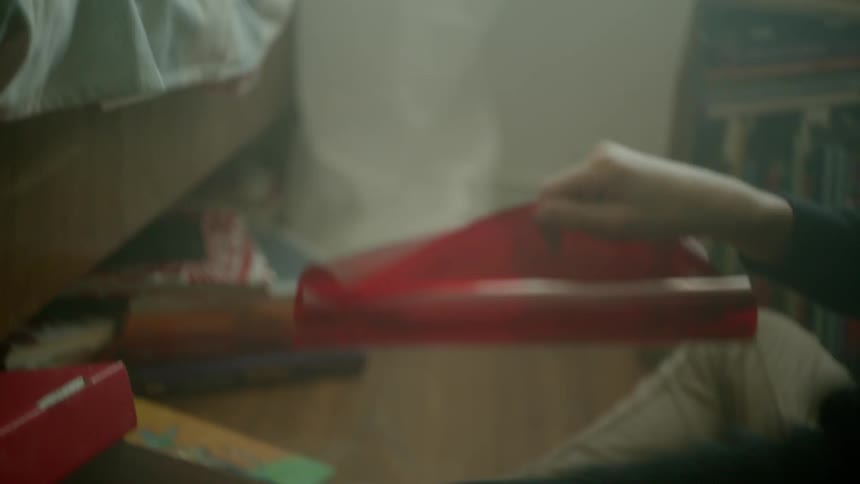 A girl is doing arts and crafts in a room