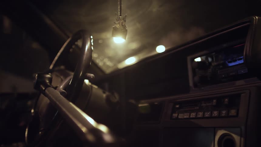 A man locks his steering wheel and leaves his car