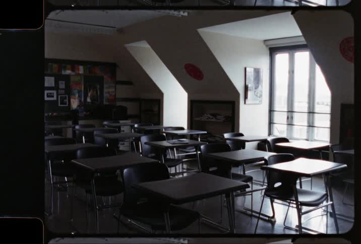 Empty classroom has ceiling to floor windows