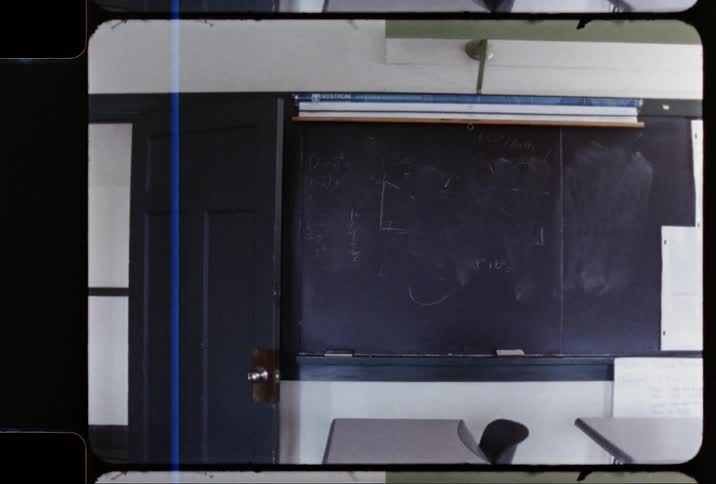 Film footage of the inside of an old classroom