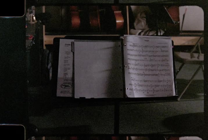Film footage of a stand holding sheet music