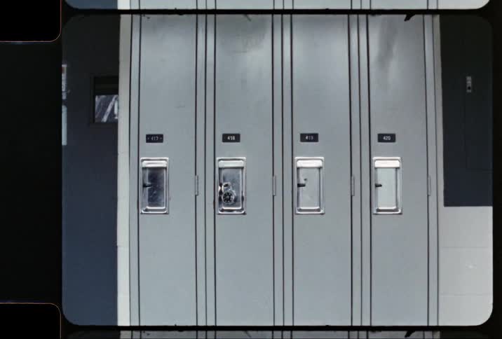 Retro steel lockers next to a screen displaying yellow font