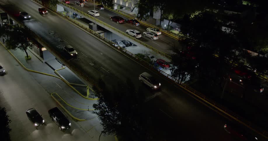An overpass through a neighborhood in a city at night