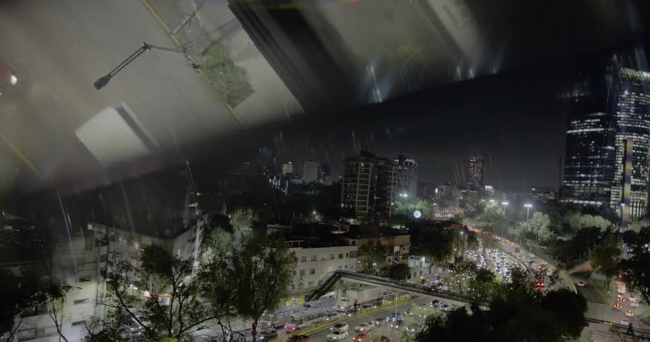 Cars are driving through a downtown city