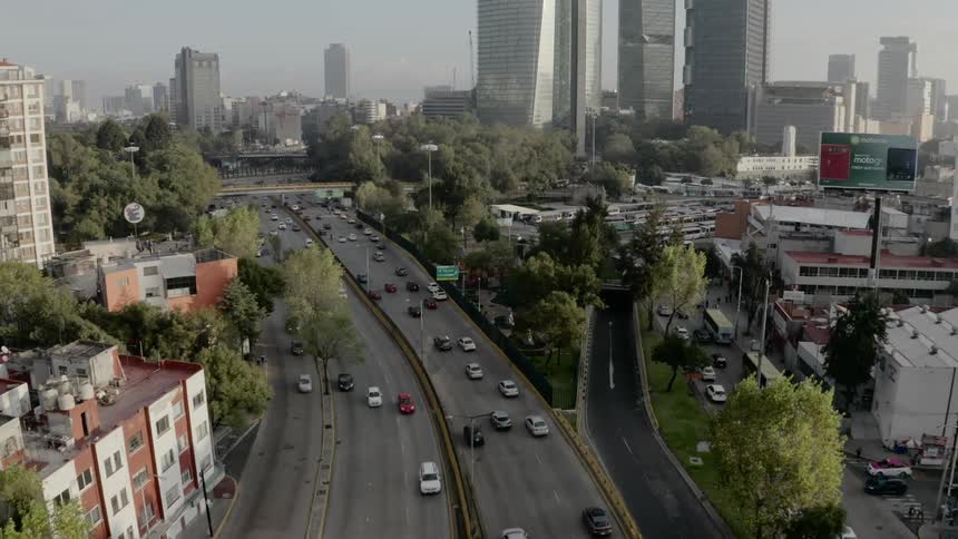 Cars driving down a city street