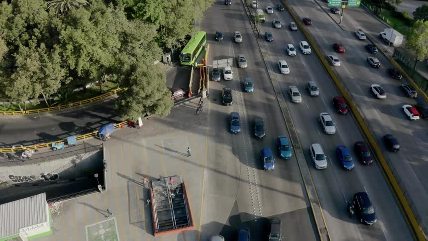 Cars are driving through a city on freeways