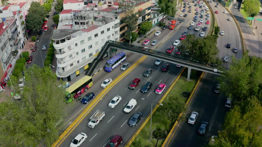 Cars are driving through a city