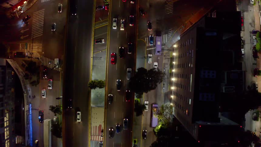 A busy highway and intersection with flashing police lights