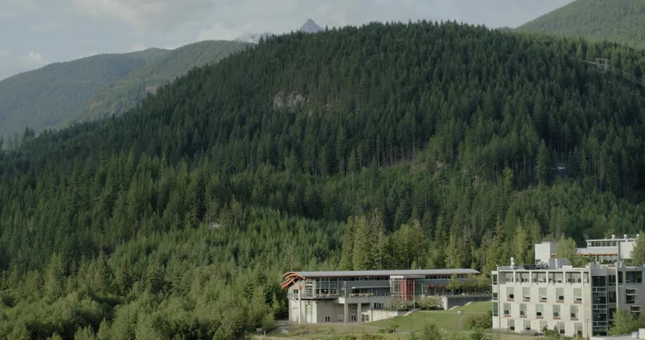 Landscape view of hotels in front of a forest