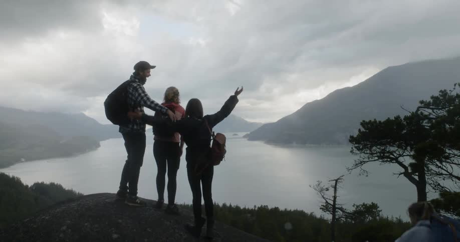 People stand at the edge of the cliff