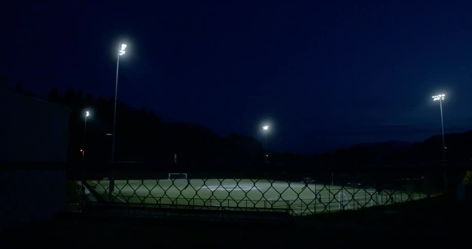 People in the distance run on the field