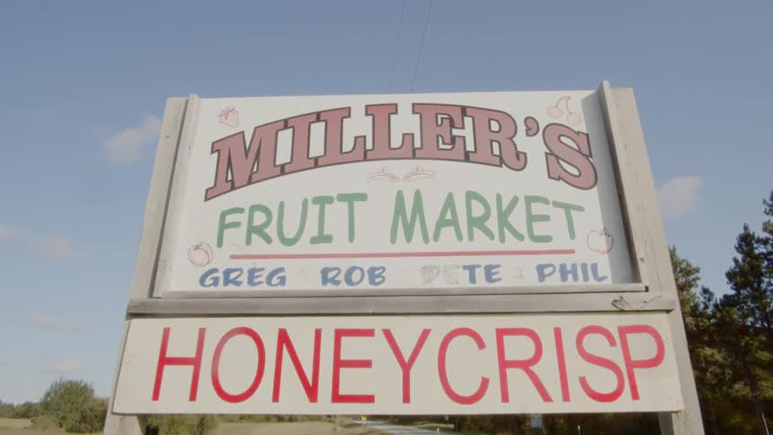 Wood frame signage of a fruit market in the country