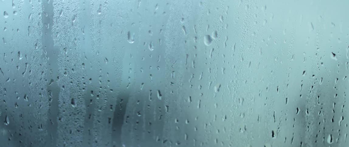 Condensation builds up on a window