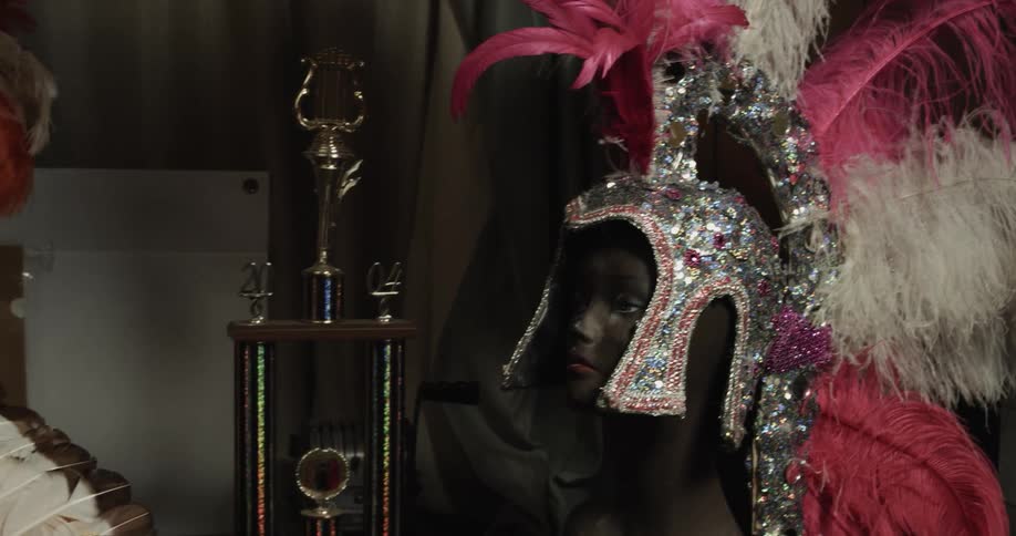 Head wear sits atop a face