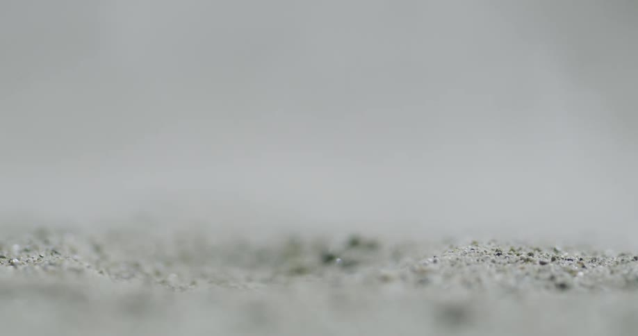 A golf ball is hit out of the sand