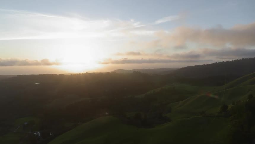 Landscape of the green hills at sunset