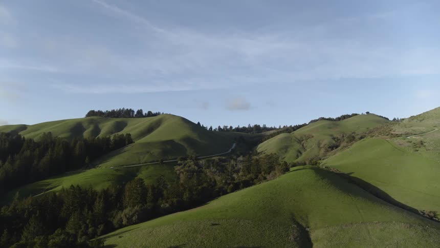 Aerial of grassy rolling hills in the countryside