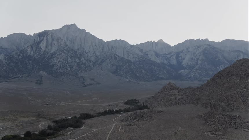 The mountains ahead are covered in ice