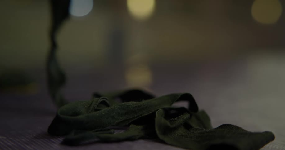 A fabric cord falling to the floor