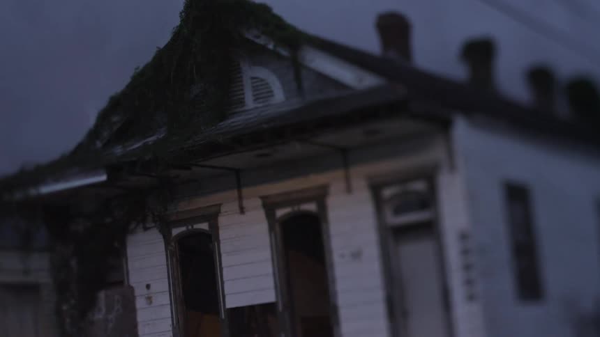 An old house with vines growing over it