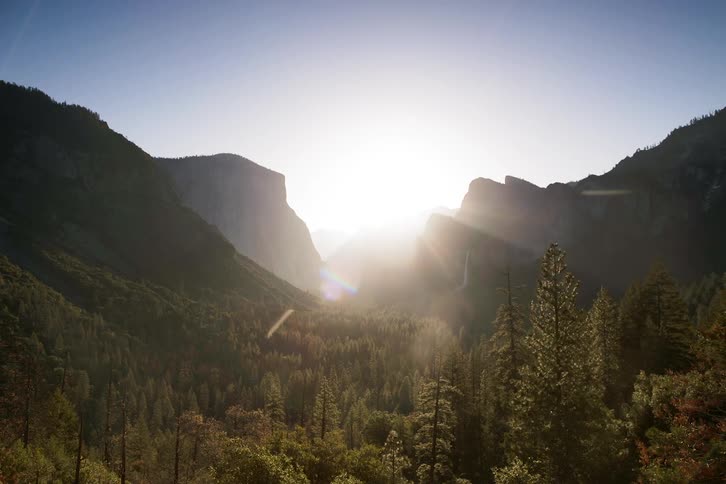 Time lapse view of the mountains with a waterfall flowing