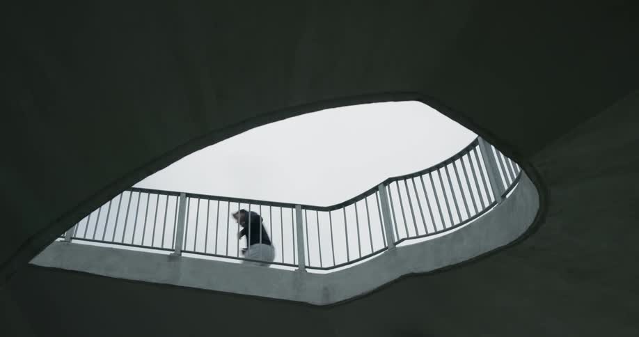 A man runs on the bridge