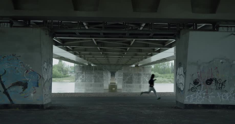 A man runs along the shoreline