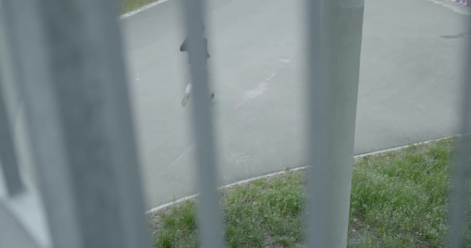 A man runs in an empty parking lot