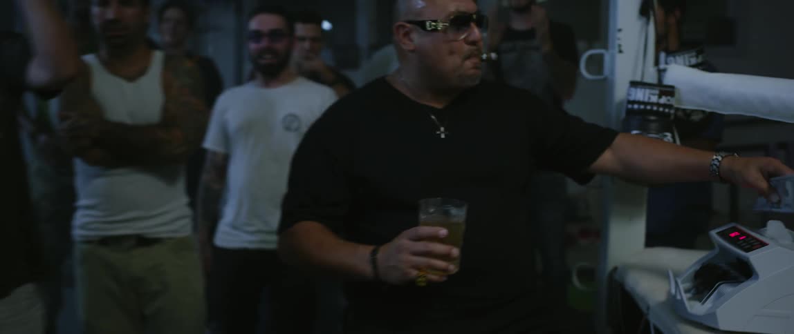 People at a boxing match making bets