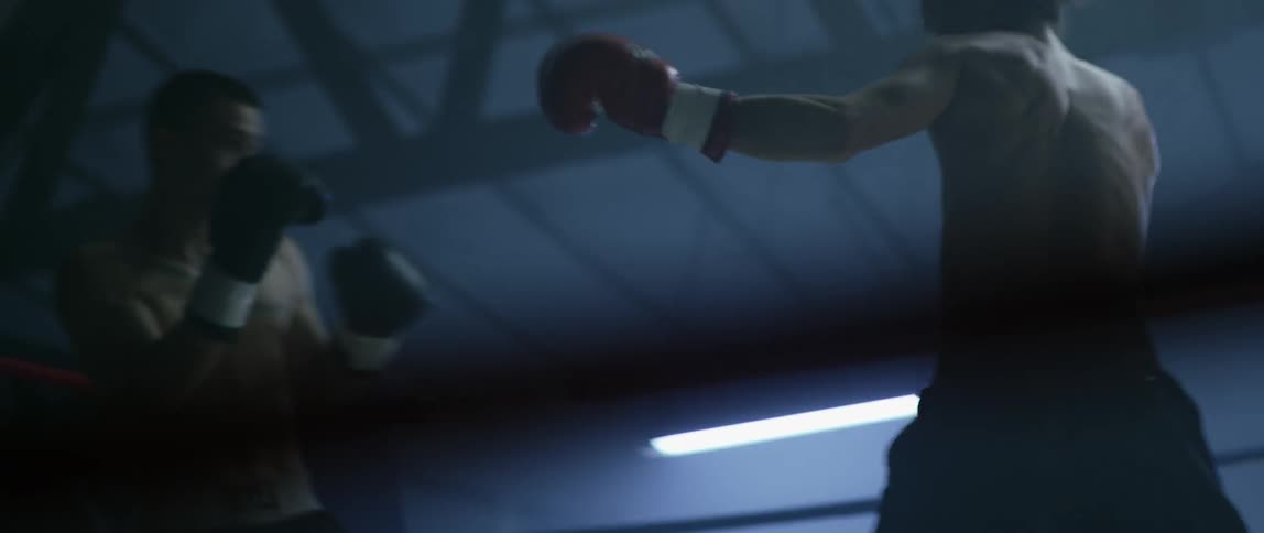 Boxers spar in a boxing ring