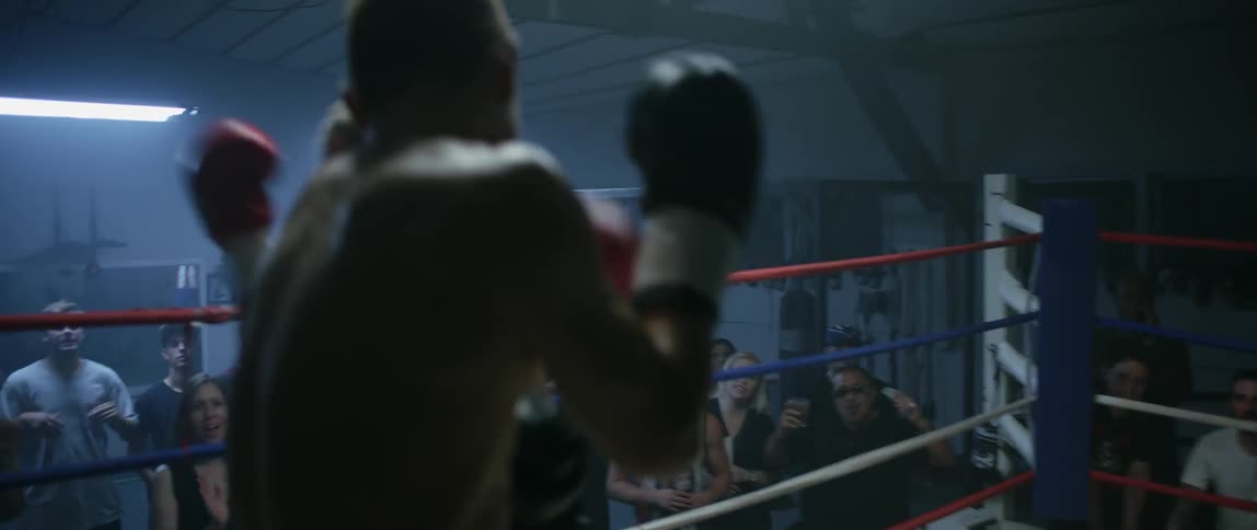 Boxers fighting in a ring