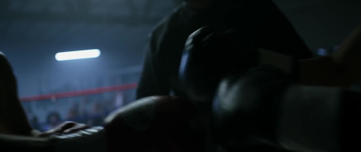 Two boxers fighting in a ring