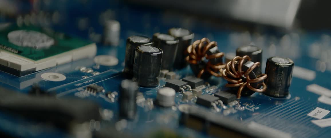 A printed circuit board has a number of cylindrical capacitors on it