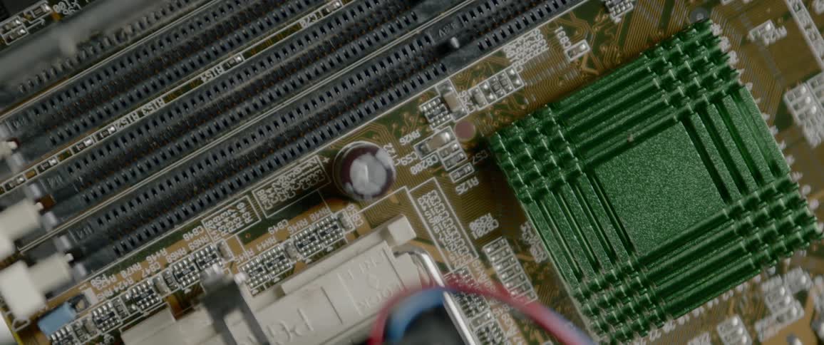 A circuit board lightly illuminated with light emitting from its center