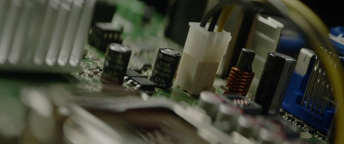 Light shines and then dims on an electrical circuit board