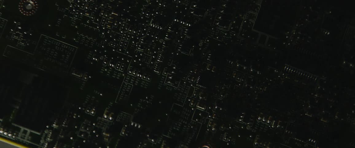 Changing light angles cause shadows on circuit board