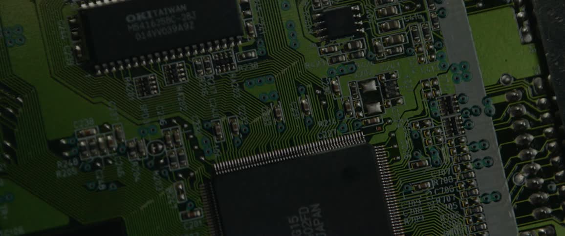 A circuit board lightly illuminated