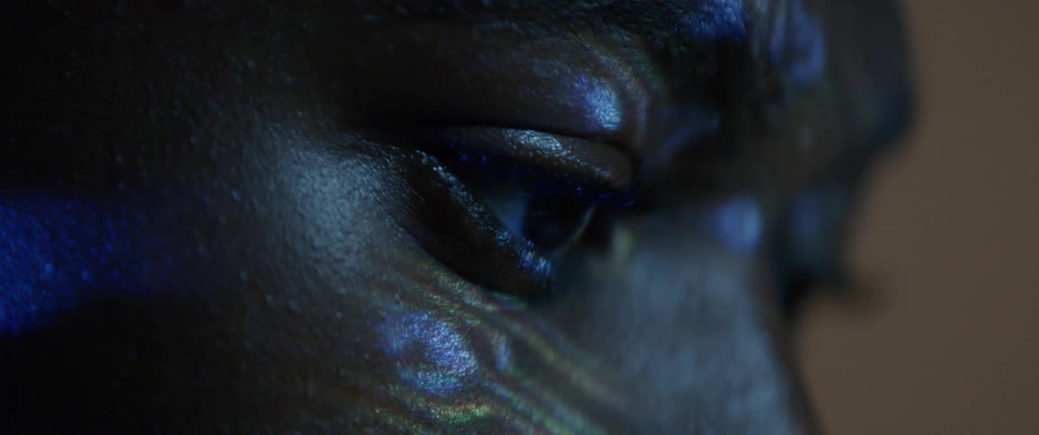A man stares into the projection