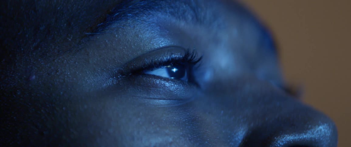 Persons eyes blink as display reflected onto their face